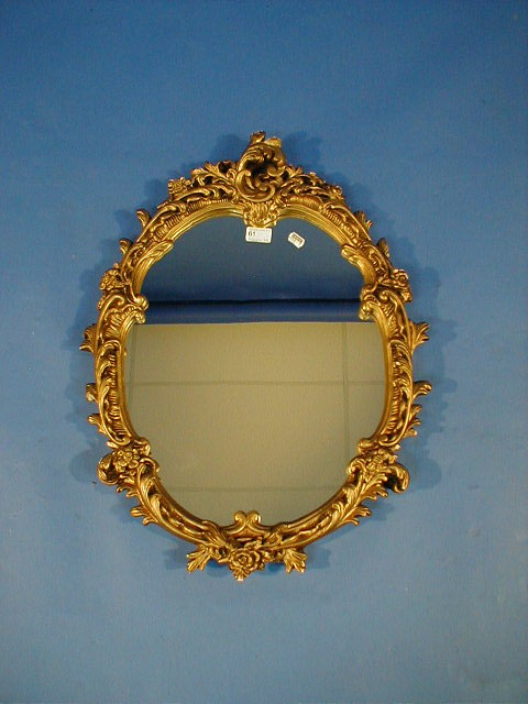 Appraisal: A rococo gilt plaster framed wall mirror