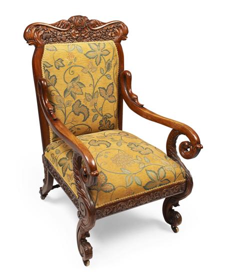 Appraisal: ANGLO INDIAN CARVED HARWOOD LIBRARY ARMCHAIR CIRCA covered in floral