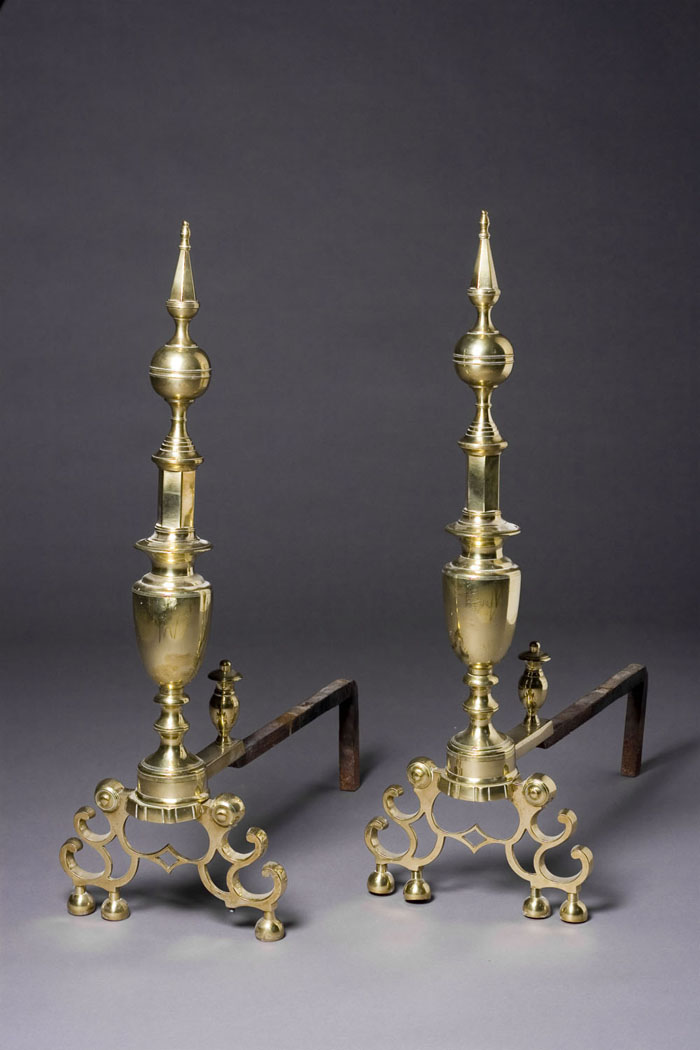 Appraisal: PAIR OF AMERICAN CHIPPENDALE BELL METAL ANDIRONS The spire and