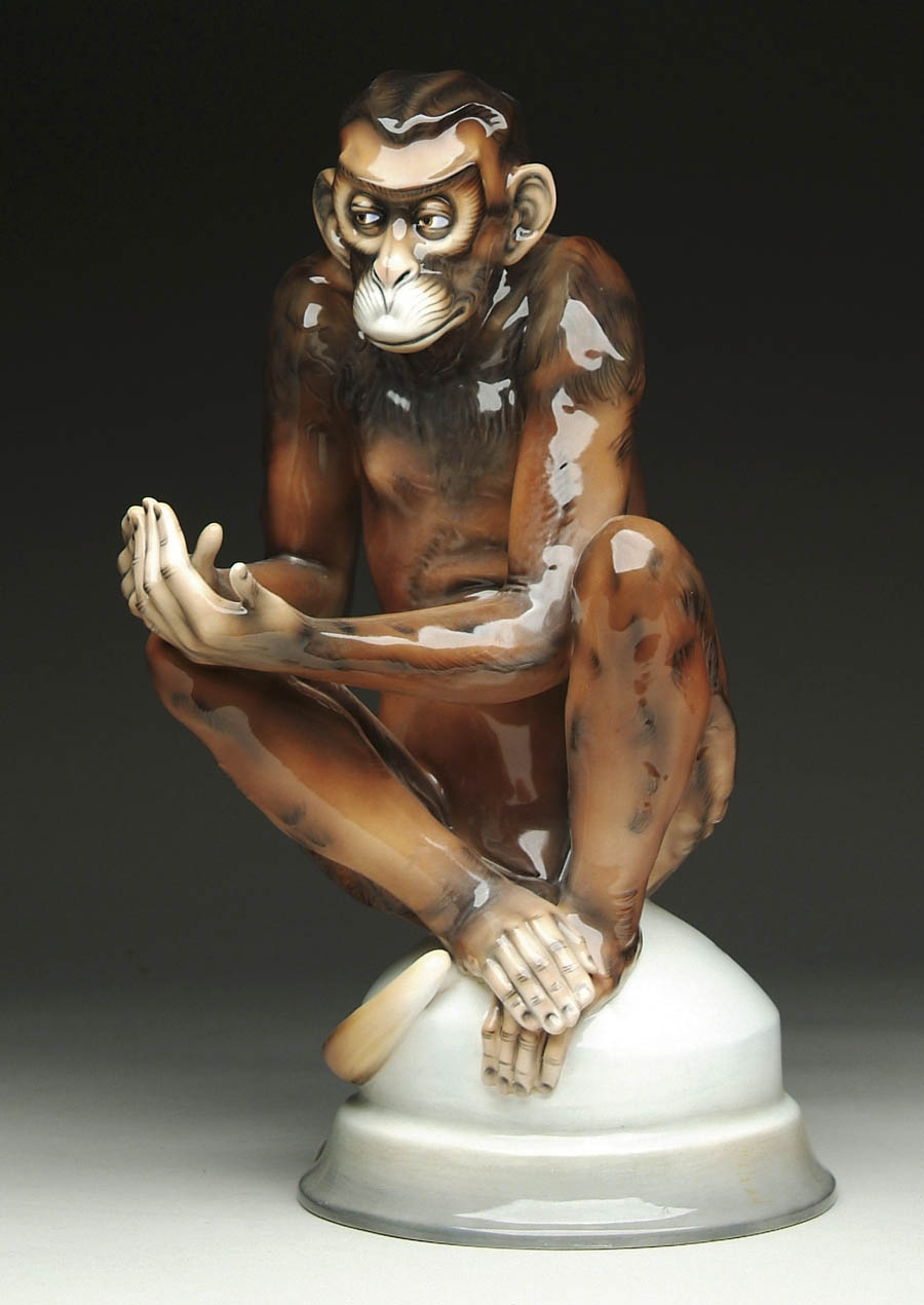 Appraisal: PORCELAIN MODEL OF A MONKEY Brown and black monkey sits