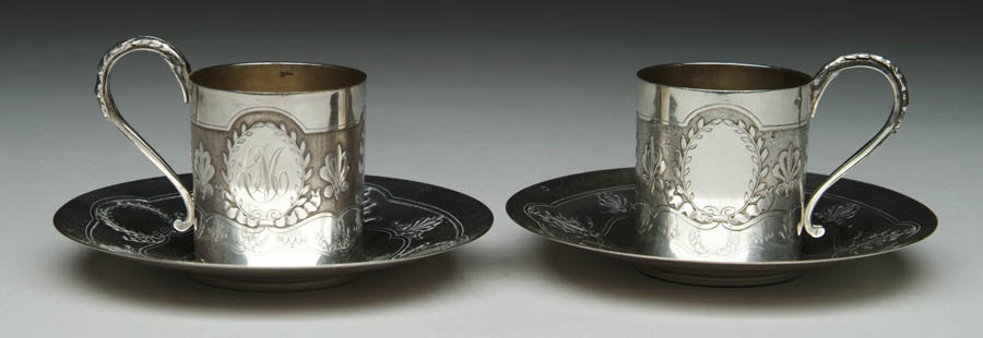 Appraisal: TWO EMILE PFUIRCAT SILVER CUP AND SAUCERS Wonderful pair of