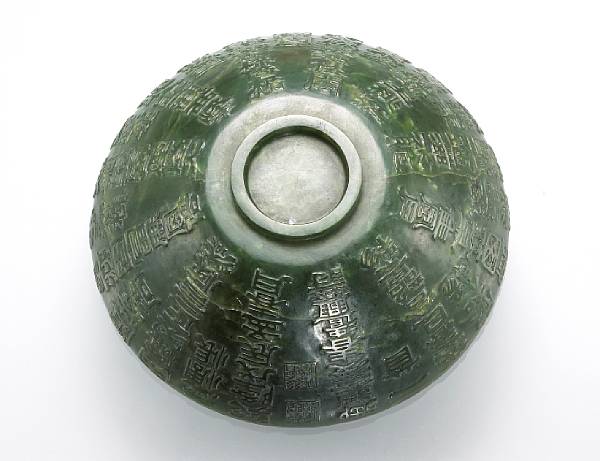 Appraisal: A 'spinach' jade bowl carved with extensive calligraphic decoration th