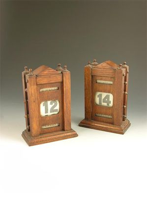 Appraisal: Two similar late Victorian oak desk calendars in cm h