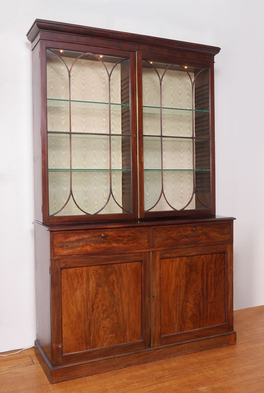 Appraisal: LATE TH CENTURY MAHOGANY BREAKFRONT BOOKCASE door glass top silk