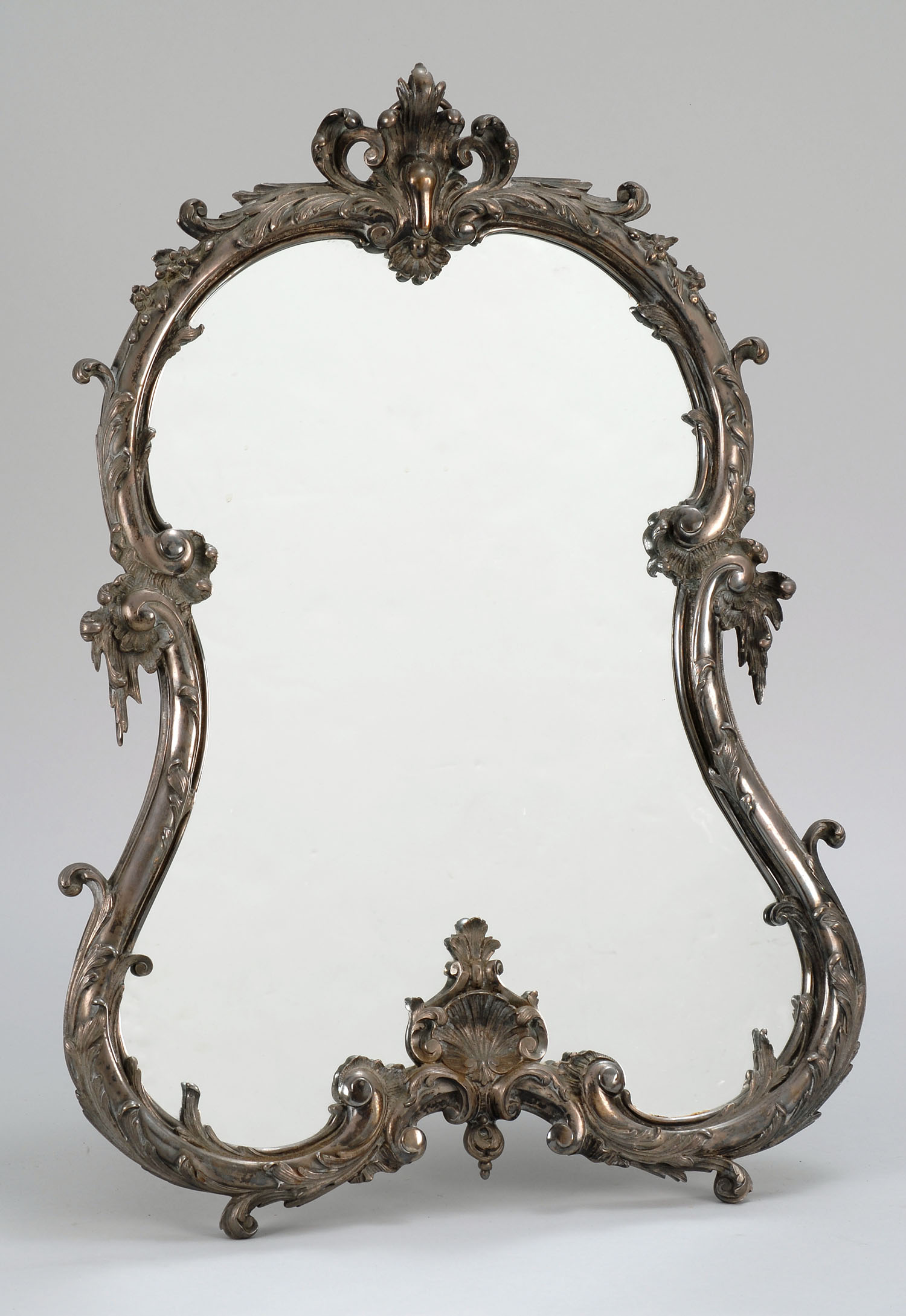 Appraisal: CONTINENTAL DRESSER MIRROR WITH SILVER PLATED FRAME In a rococo