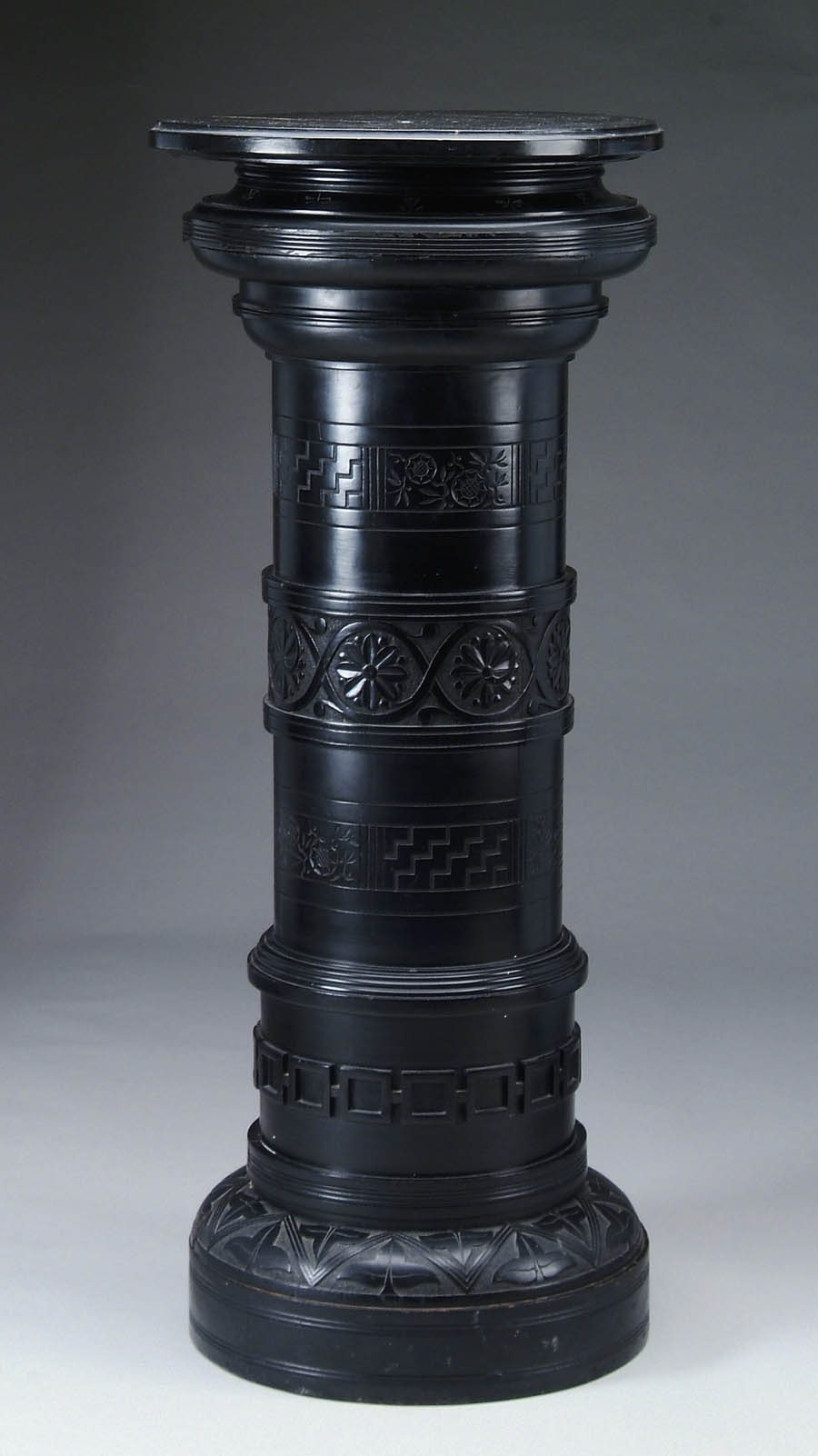 Appraisal: FINE LARGE EBONIZED PEDESTAL Round column pedestal has leaf carving