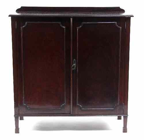 Appraisal: A mahogany cupboard with twin panel doors cm wide