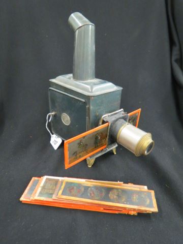 Appraisal: Antique Oil Lamp Projector tin with glass slides signed E