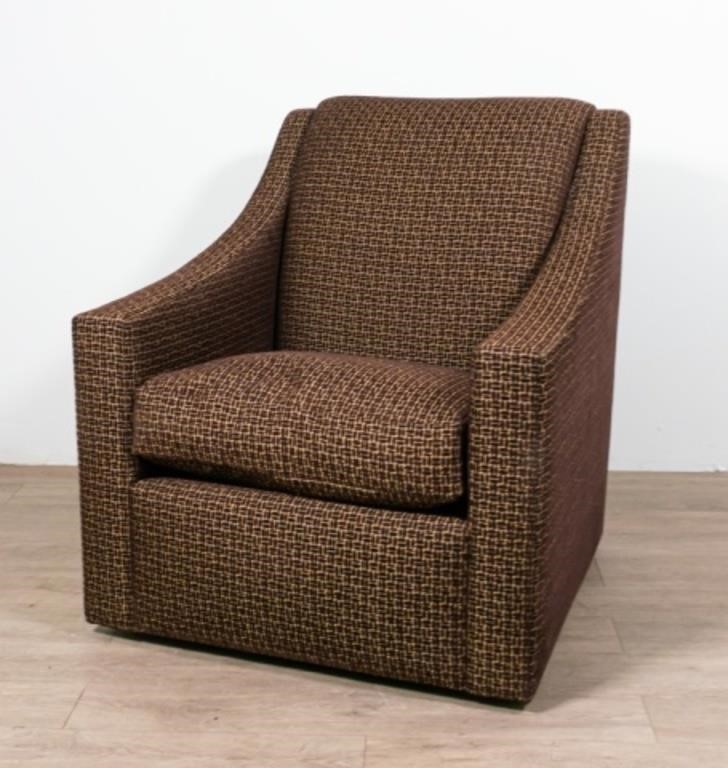 Appraisal: A Rudin upholstered swivel base club chair American st Century