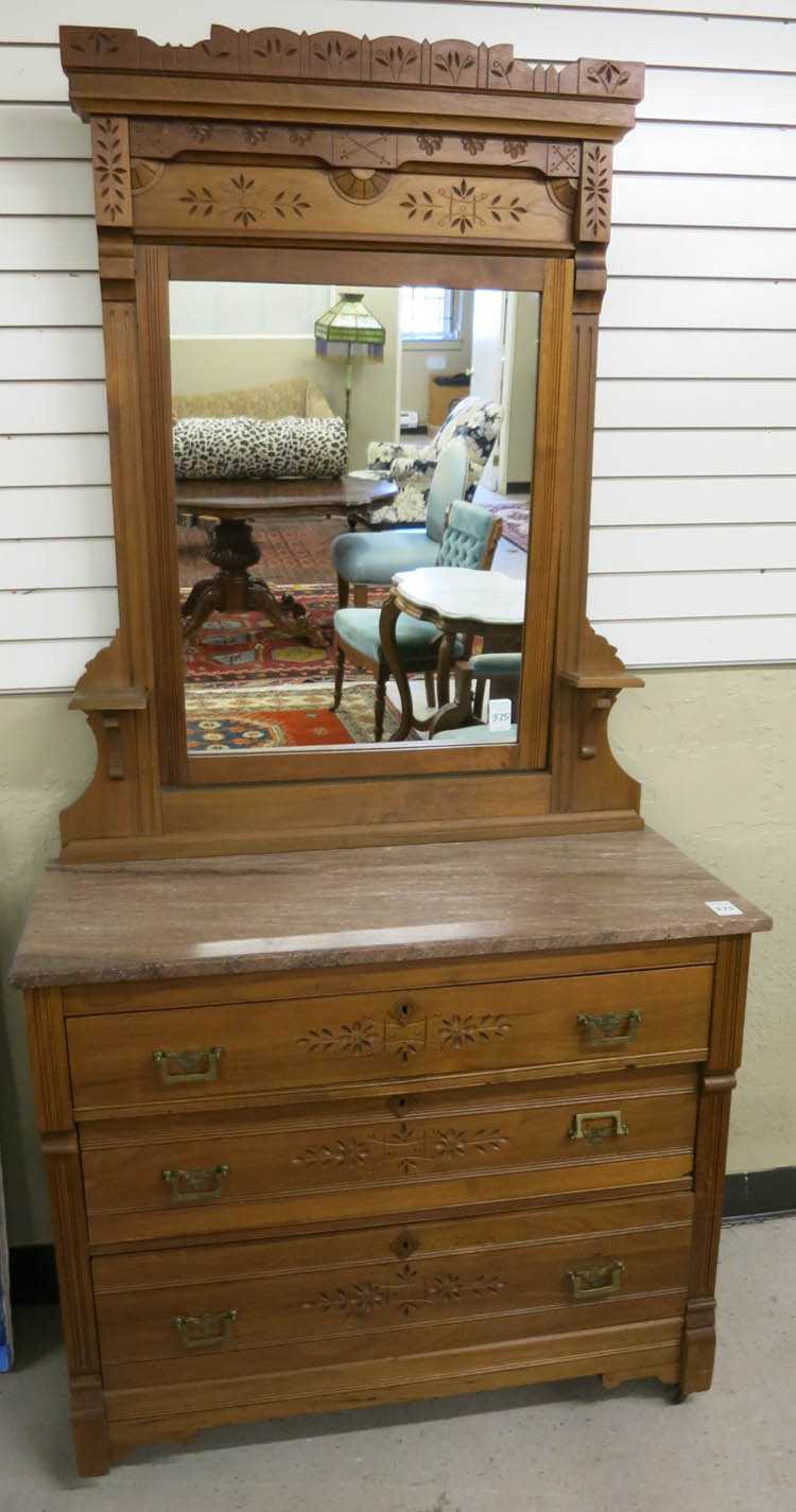 Appraisal: VICTORIAN MARBLE-TOP WALNUT DRESSER WITH MIRROR Charles Eastlake design American