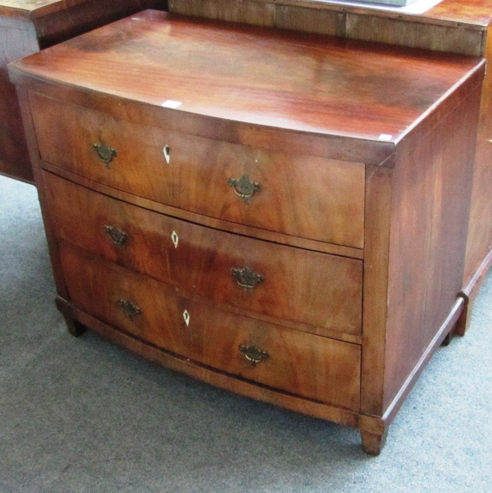 Appraisal: An early th century continental mahogany bowfront chest with three