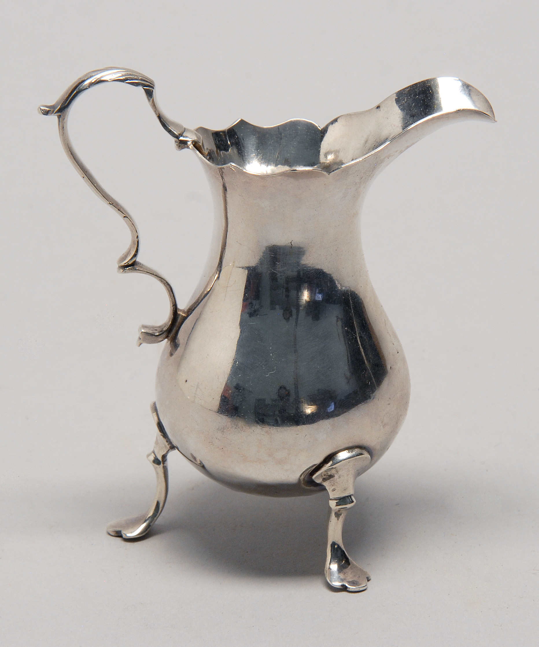 Appraisal: GEORGE III STERLING SILVER CREAMER London - William Kersill maker