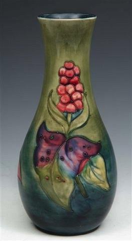 Appraisal: A MOORCROFT PALE GREEN AND BLUE GROUND VASE decorated with