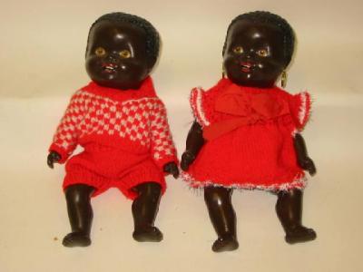 Appraisal: A pair of composition black baby dolls with painted faces