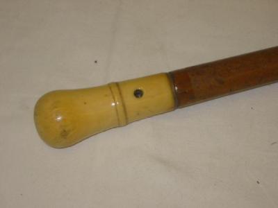 Appraisal: A MALACCA WALKING STICK with turned ivory grip pierced for