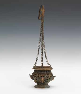 Appraisal: A Bronze Hanging Censer The cast bronze receptacle is pierced