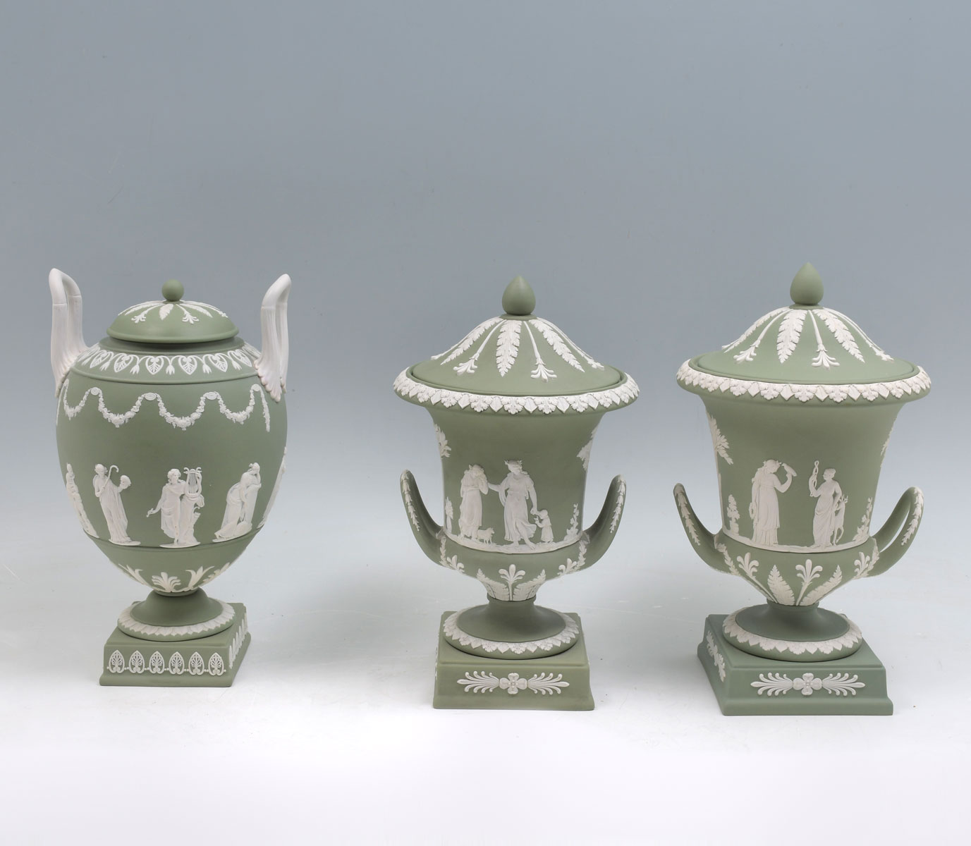 Appraisal: PC WEDGWOOD GREEN JASPERWARE COVERED URNS Comprising A pair of