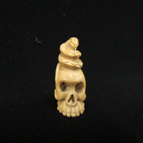 Appraisal: Carved Ivory Netsuke of a Skull snake on top signed