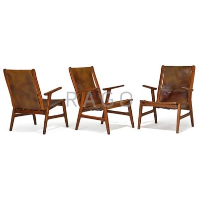 Appraisal: DANISH Three lounge chairs s Stained oak stitched saddle leather