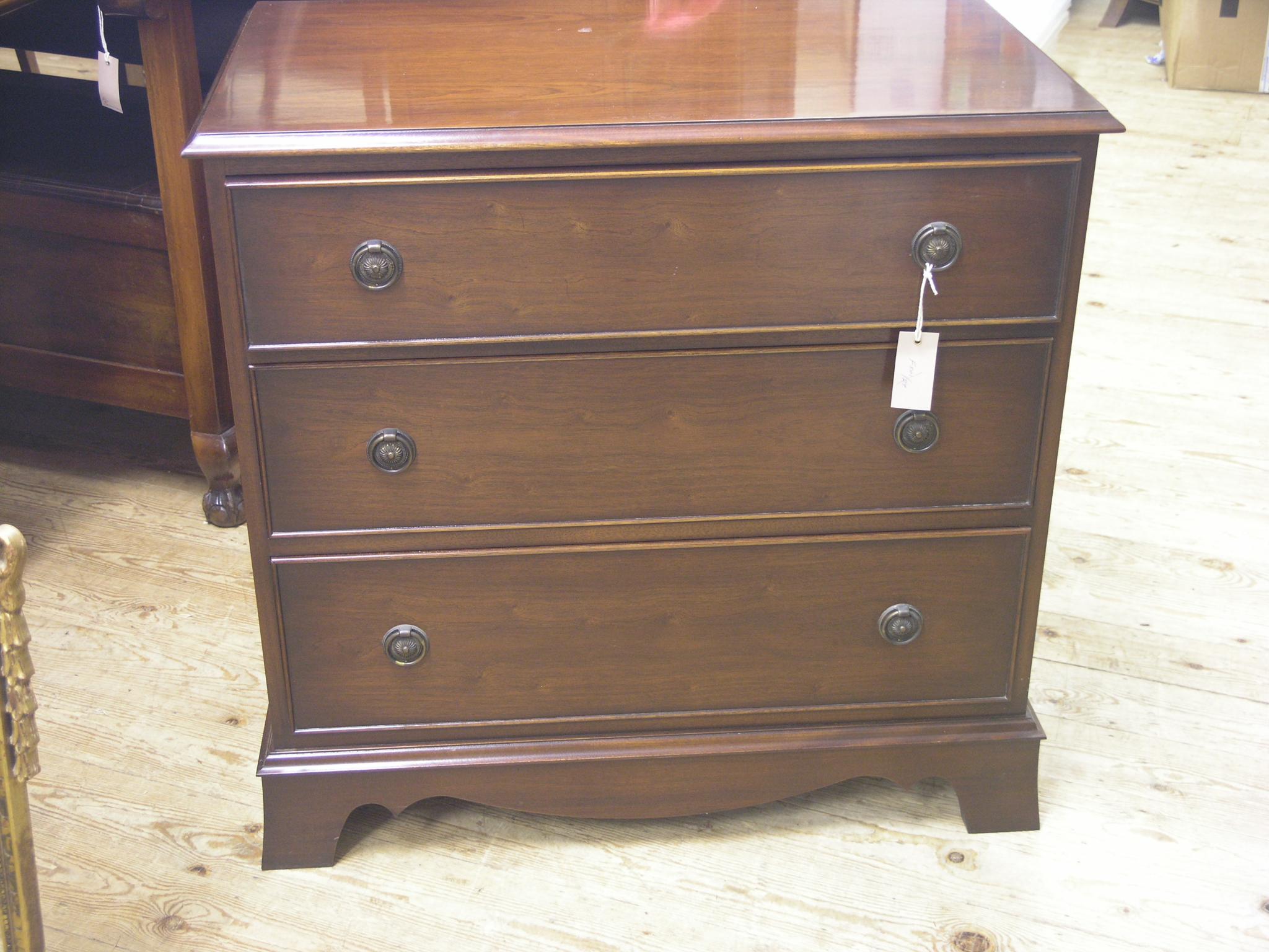 Appraisal: A Bevan Funnell Reprodux mahogany chest three long cock-beaded drawers