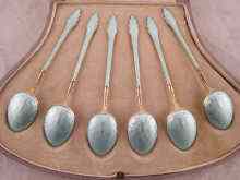 Appraisal: A set of six continental silver gilt enamelled teaspoons in