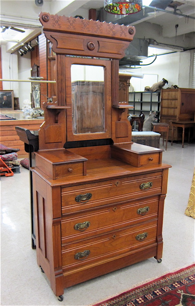 Appraisal: VICTORIAN WALNUT DRESSER WITH TILT MIRROR Eastlake style American c