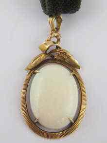 Appraisal: A yellow metal tests carat gold opal pendant the opal