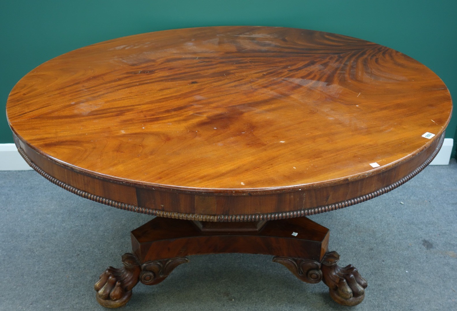 Appraisal: An early Victorian mahogany circular snap top breakfast table on