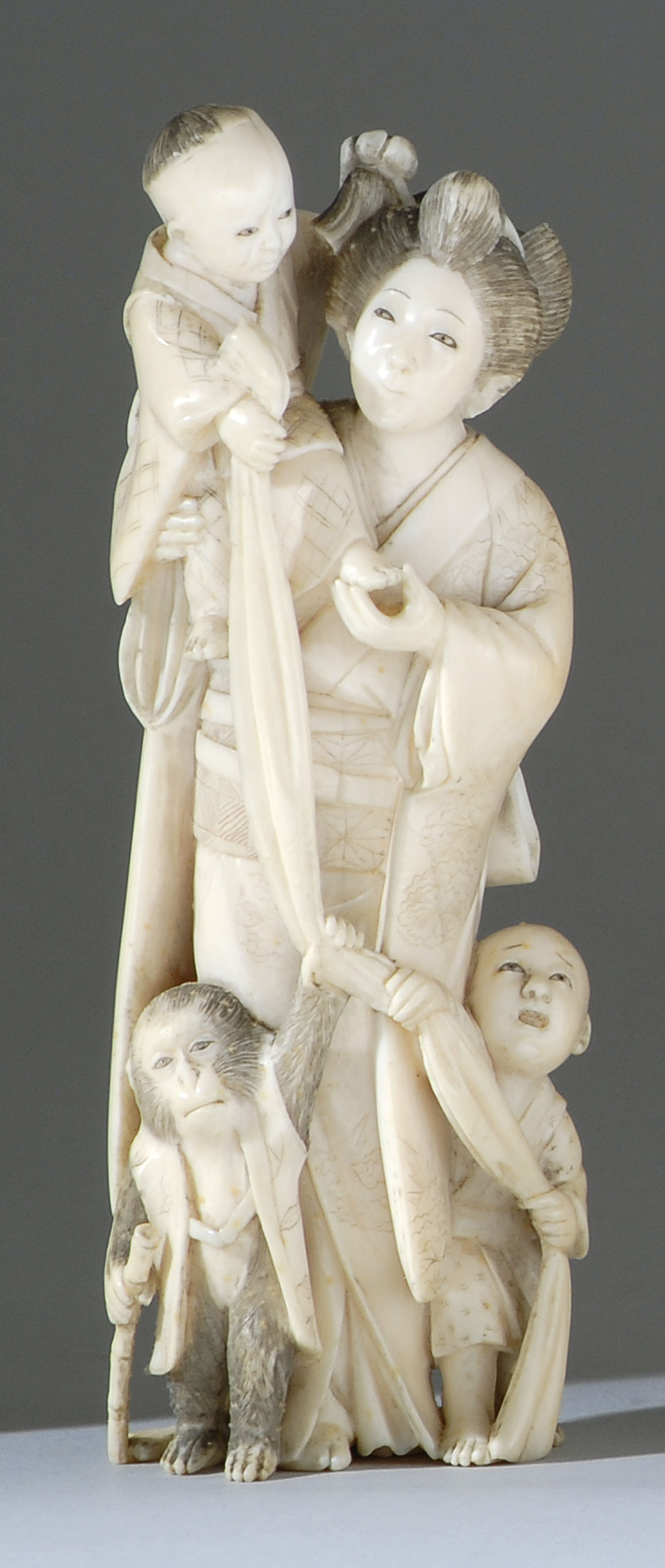 Appraisal: IVORY FIGURE OF A WOMAN Meiji PeriodIn standing position with