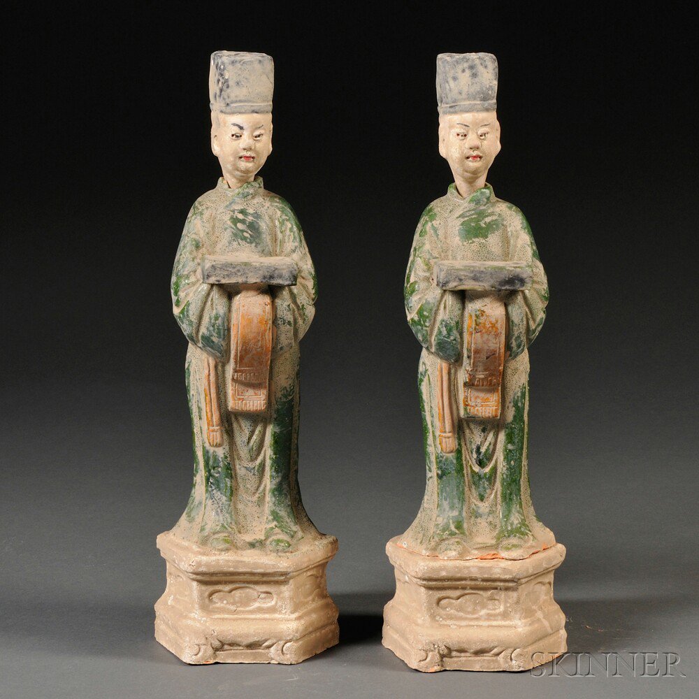 Appraisal: Pair of Sancai-glazed Clay Figures China almost identical with a