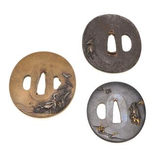 Appraisal: Antique Japanese soft metal and iron tsuba Antique Japanese soft