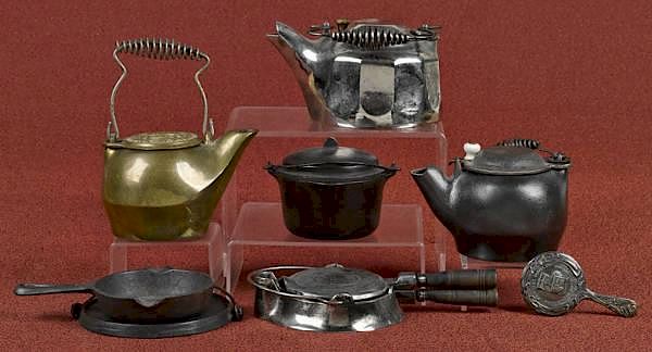 Appraisal: Miniature cast iron cooking items to include a G Miniature