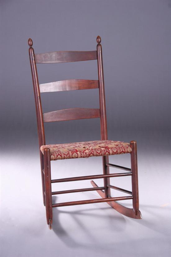 Appraisal: AMERICAN SHAKER ROCKER Branded with numeral Ladder-back with woven trapezoidal