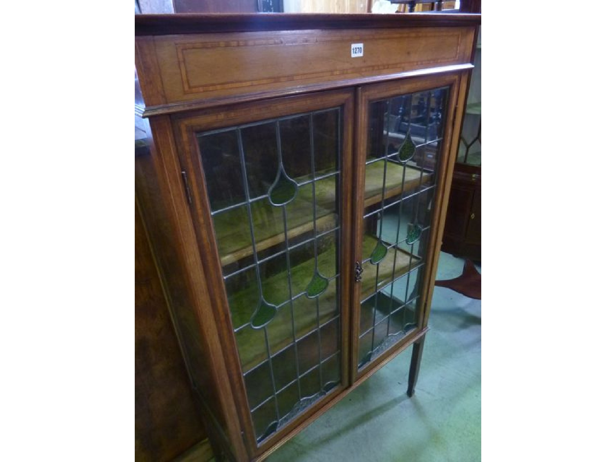 Appraisal: An inlaid Edwardian mahogany display cabinet with satinwood banding and