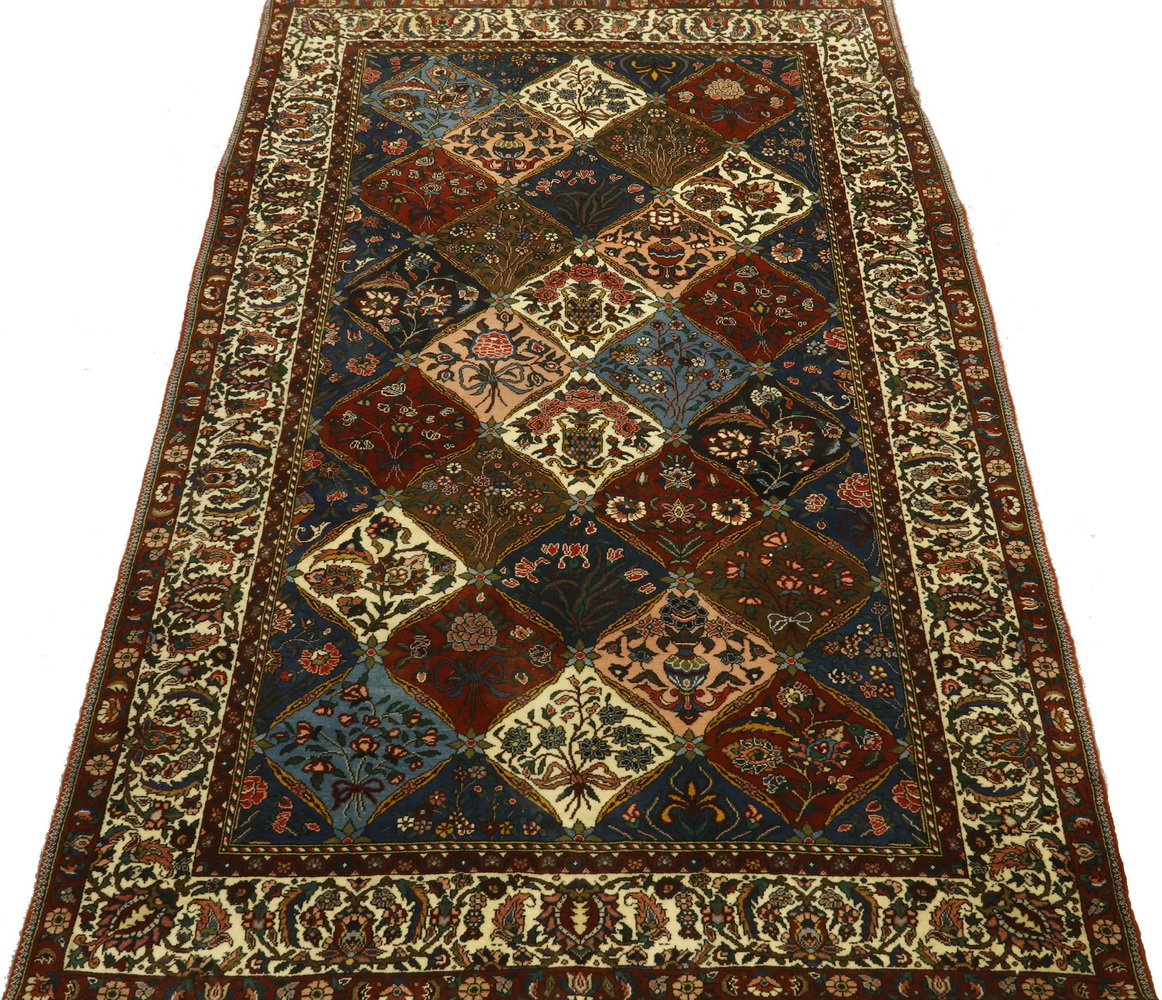 Appraisal: BAHKTIARI RUG Diamond lattice of vases and flowering vines in