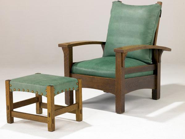 Appraisal: GUSTAV STICKLEY Bow-arm Morris chair and footstool the drop-in spring