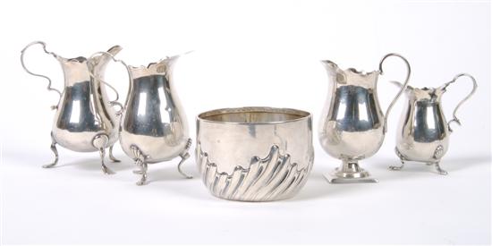 Appraisal: A Group of Four English Sterling Silver Cream Jugs Height