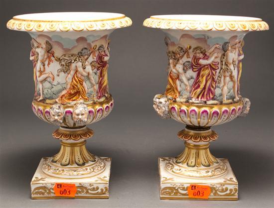 Appraisal: Pair of Capodimonte Classical style relief decorated porcelain urns th