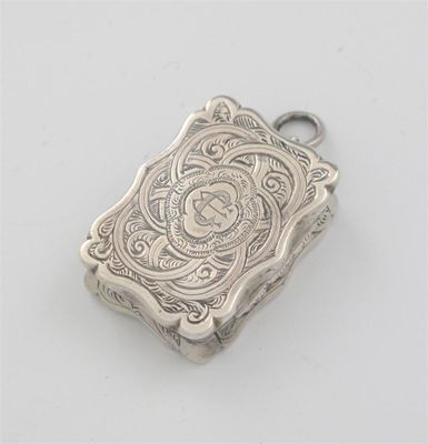 Appraisal: A Victorian engraved vinaigrette with a shaped serpentine outline and