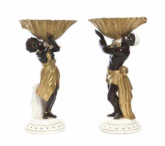 Appraisal: A Pair of Italian Blackamoor Compotes depicted supporting a shell