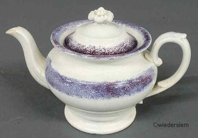 Appraisal: Purple spatterware teapot early th c ''h x ''w