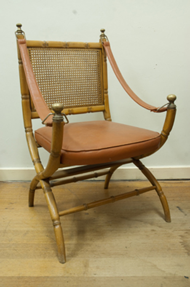 Appraisal: PERIOD RATTAN AND LEATHER ARMCHAIR