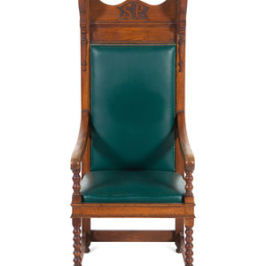 Appraisal: A Jacobean Style Carved Oak Armchair Circa the crest rail