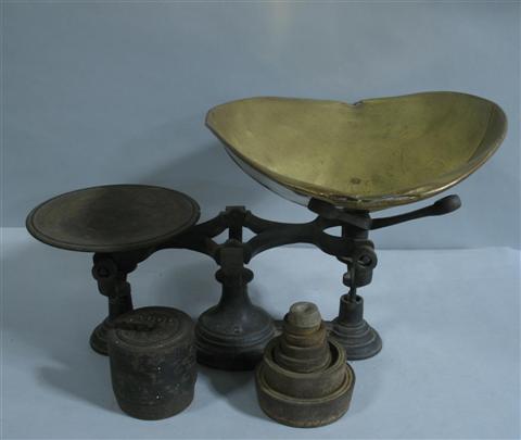 Appraisal: CAST IRON AND BRASS SCALE With brass pan and nine