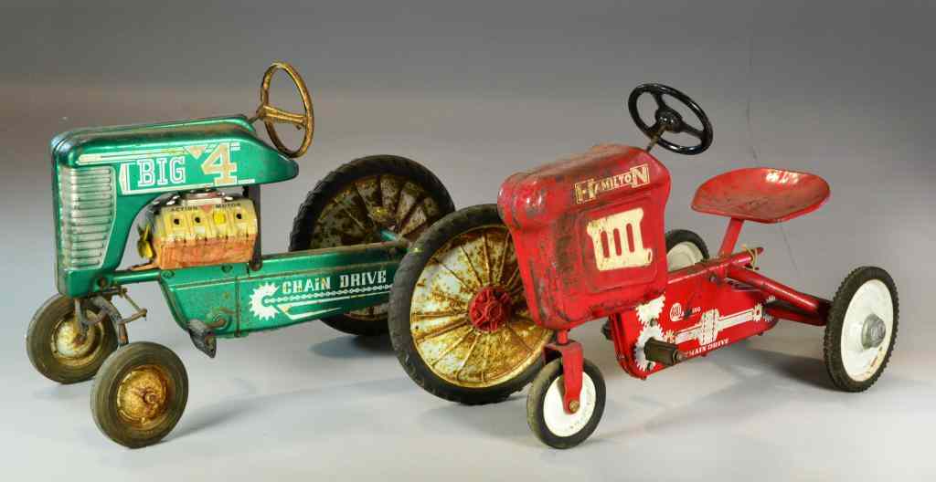 Appraisal: Antique Pedal Car TractorsTo include a red Hamilton tractor in