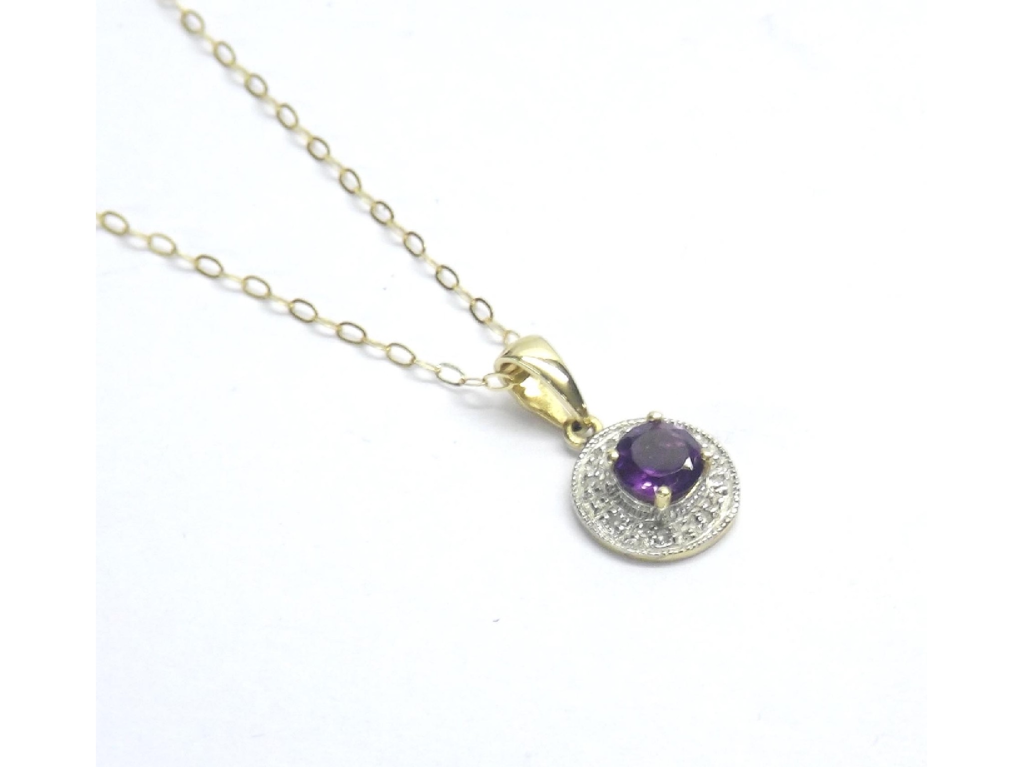 Appraisal: Amethyst and diamond circular pendant on a slender ct trace