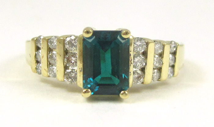 Appraisal: EMERALD DIAMOND AND TEN KARAT GOLD RING with nine round-cut