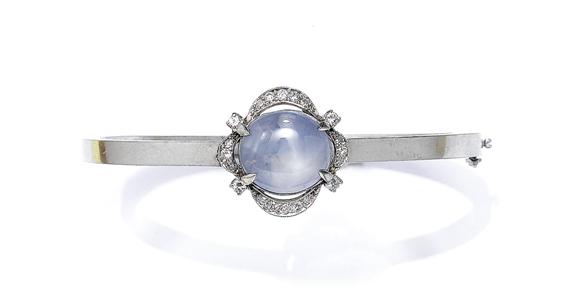 Appraisal: AN ASTERIA SAPPHIRE AND DIAMOND BANGLE circa White gold Classic