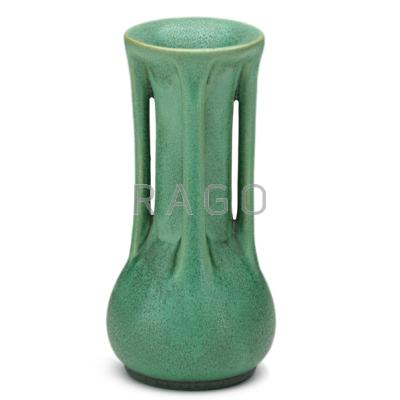 Appraisal: TECO Bud vase with four buttresses green glaze with charcoaling