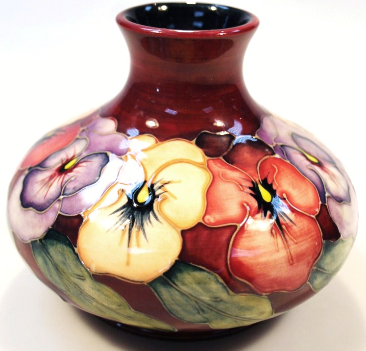 Appraisal: A Moorcroft Pansy vase by Barbara Mountford of compressed bellied